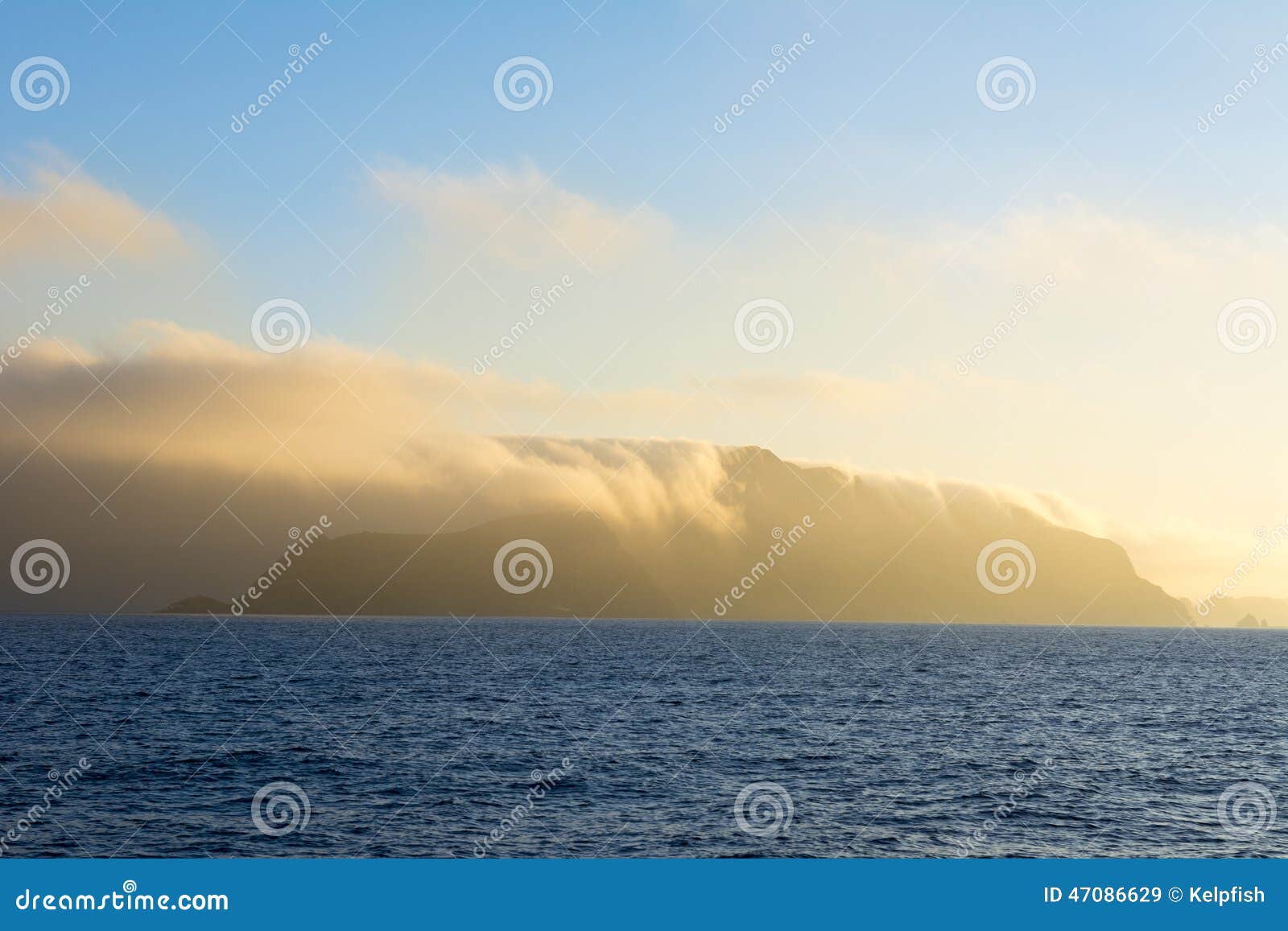 island engulfed in clouds